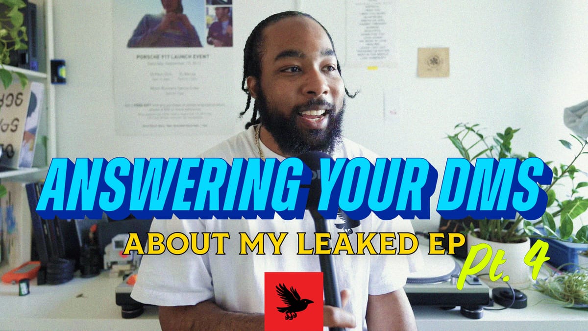 Paul is wearing a white t-shirt, and holding a microphone. His hair is braided. The title graphic for Answering Your DMs is set in front of him.