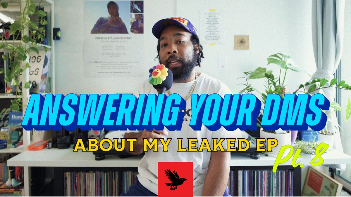 Title card for Answering Your DMs 8. Paul is wearing a white tee, and a blue hat, holding a microphone with a Murakami flower on it.