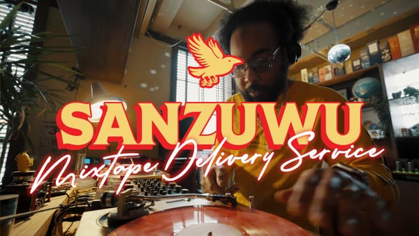 A still from the video, wherein Paul Chin is placing the needle on a pink marbled vinyl record.